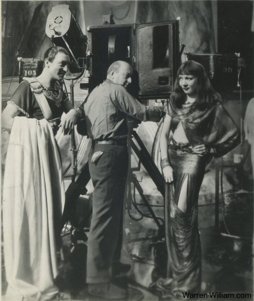 Warren William and Claudette Colbert on the set of Cleopatra